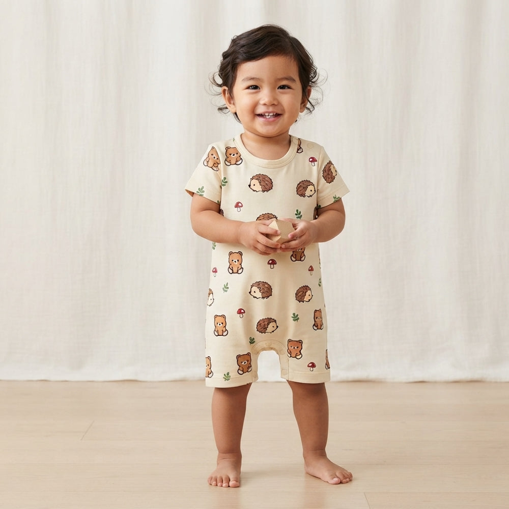 baby wearing bamboo short rompers in adorable woodsy bear and hedgehog prints, cooling and eczema friendly kids wear in Singapore