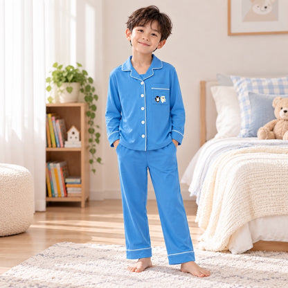 kids wearing blue colour long sleeve bamboo pyjamas at bedroom. soft and suitable for eczema prone skin material