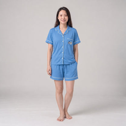 women model wearing blue colour Cuteboid brand bamboo cooling pyjamas in short sleeve and shorts