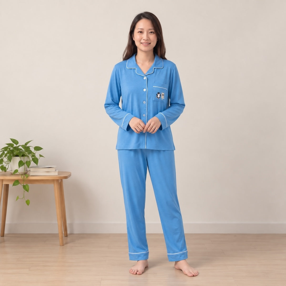women wearing Cuteboid long sleeve bamboo pyjamas in blue colour with pocket.