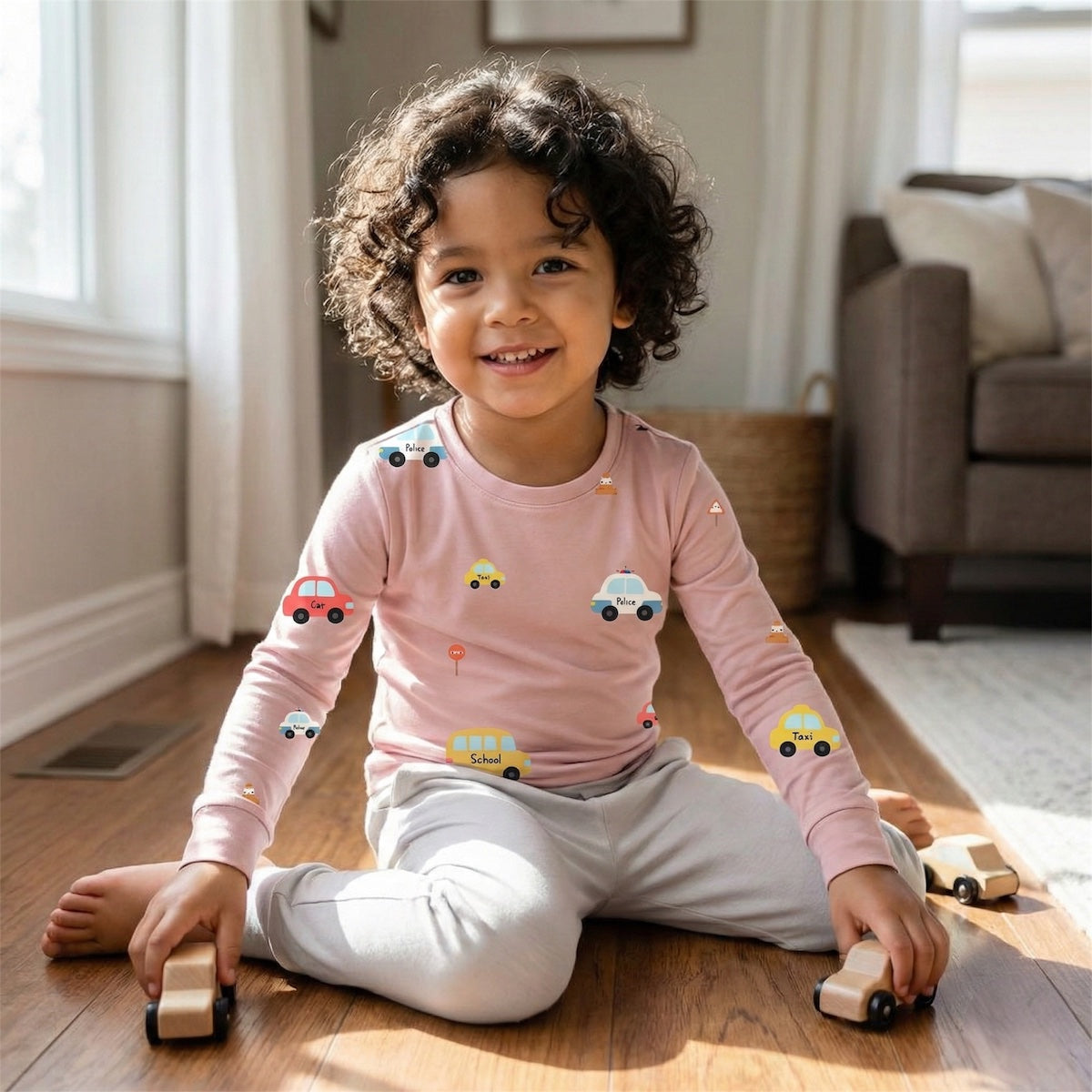 child wearing long sleeve bamboo t-shirt sitting on the floor playing