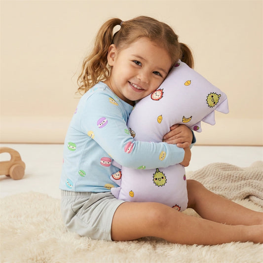children holding a bamboo pillow that is soft and soothing, in tropical fruit design